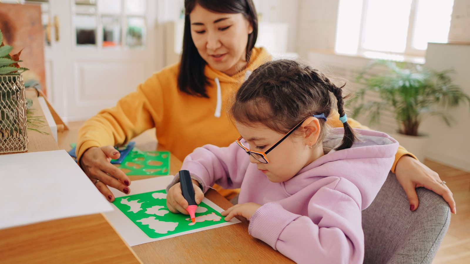 Abeka – Mom and Daughter Learning at Home Abeka curriculum - parent guiding child with hands-on learning activities