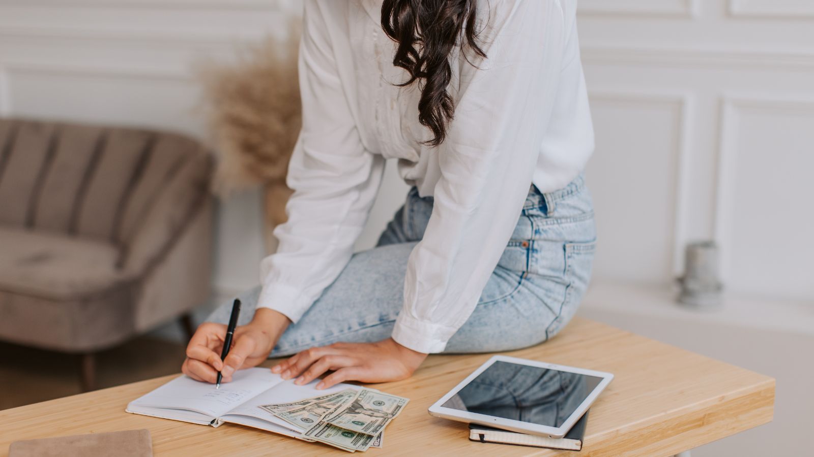 A homeschool moms works on creating a budget for her family's educational needs.