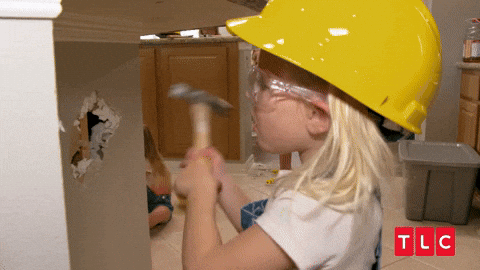 A girl destroys a kitchen.